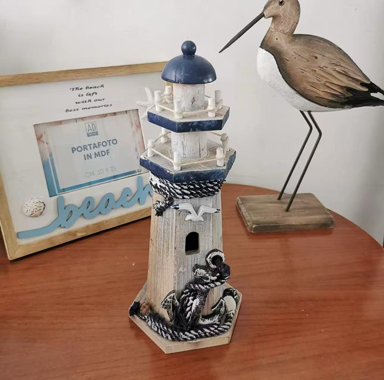 Nautical-themed lighthouse figurine, perfect as a beach-style centerpiece for your bathroom or home decor.